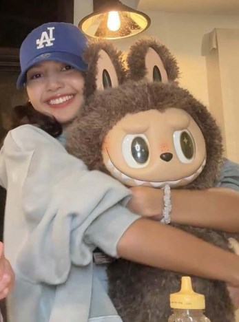 lisa with her labubu doll